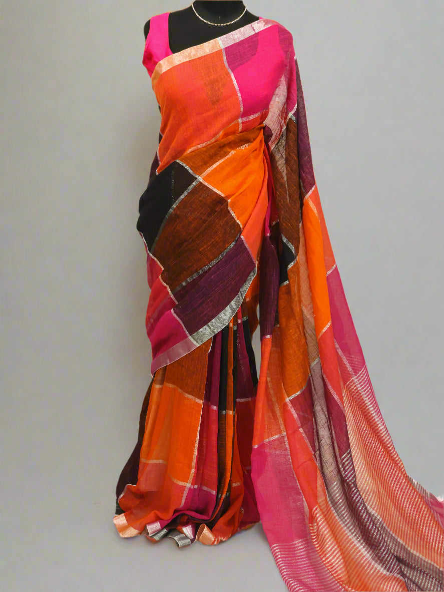A multicolored silver box linen saree displayed on a model, featuring geometric patterns and tassels, with a length of 5.5 meters and a 1-meter blouse piece.