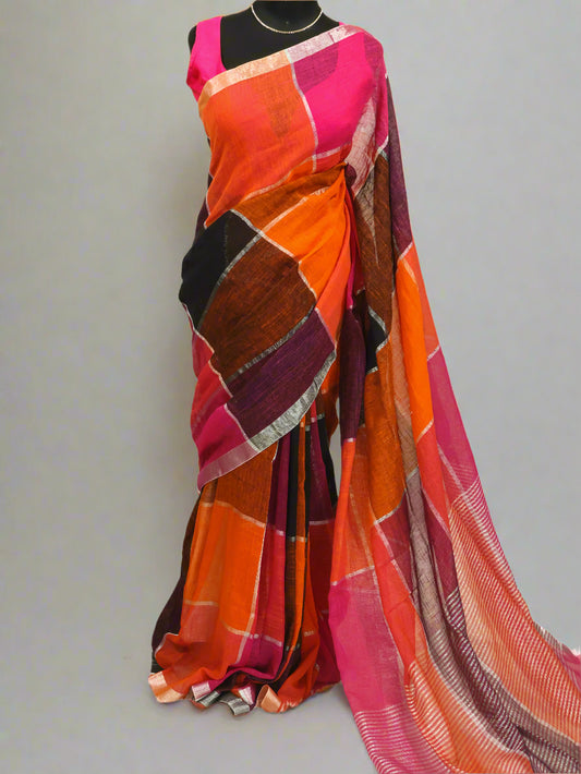 A multicolored silver box linen saree displayed on a model, featuring geometric patterns and tassels, with a length of 5.5 meters and a 1-meter blouse piece.