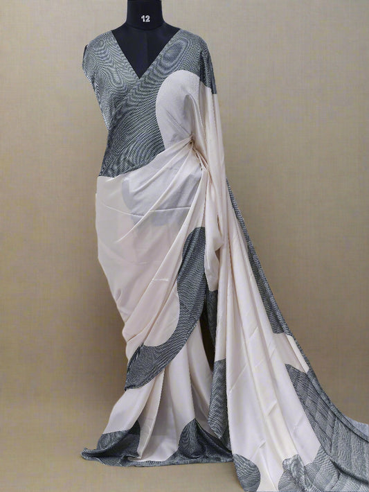 Gray and white saree on a mannequin against a white background