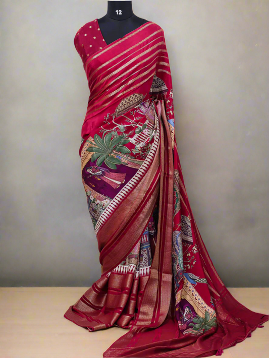 Red saree with intricate patterns on a white background, branded 'Aurat Designs'.