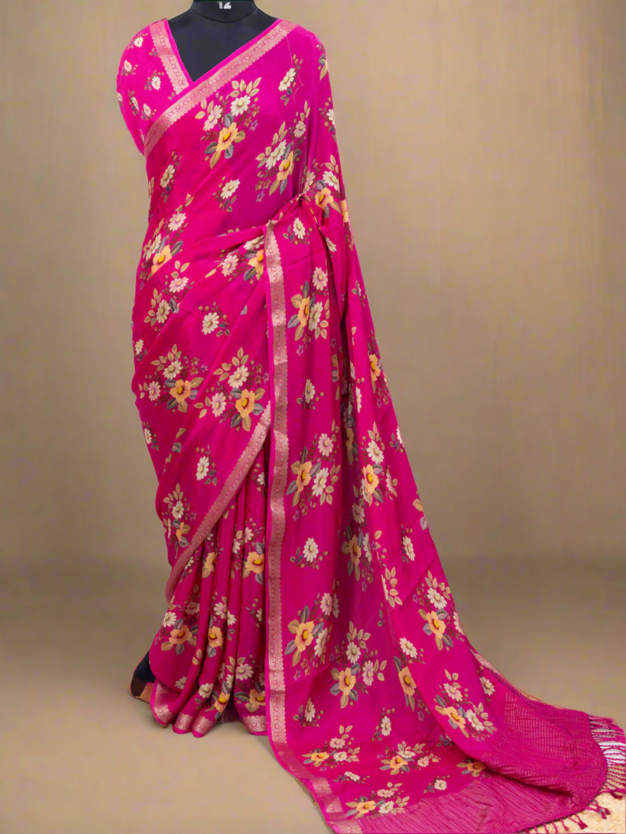 Pink saree with floral patterns on a white background, branded 'Aurat Designs'.